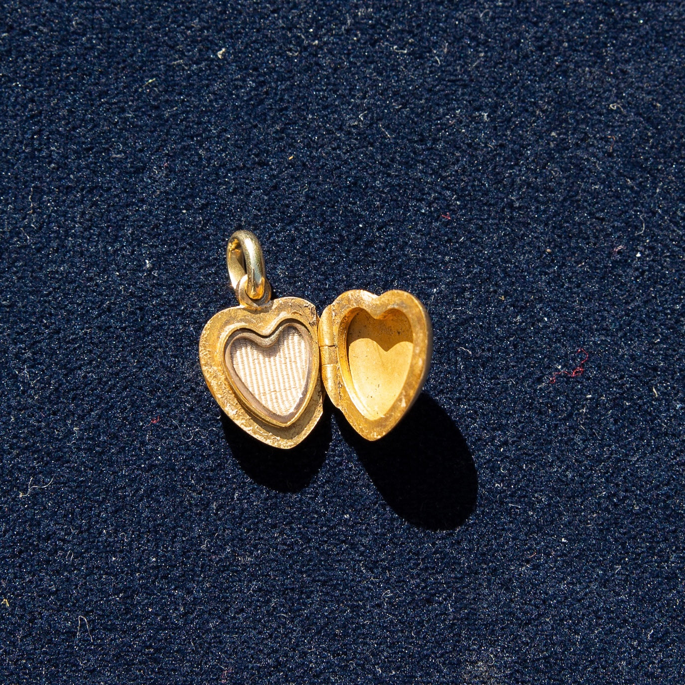 Sold at Auction: A 9K Yellow Gold Heart Locket Pendant on a 9K